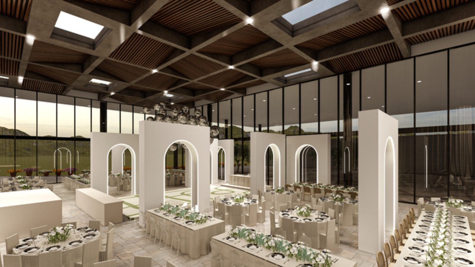 Visualización del salón de día: arcos blancos frente a ventanales altos, mesas largas y redondas vestidas de blanco y verde.